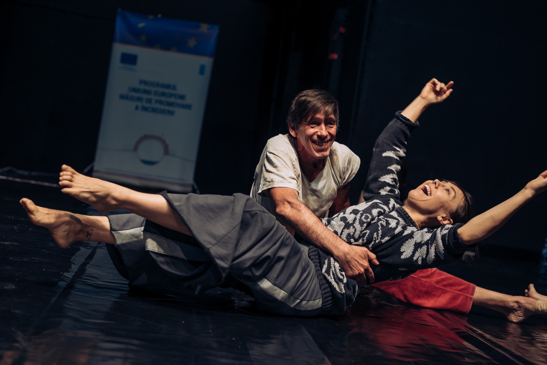 Performers sharing movement and attention on stage